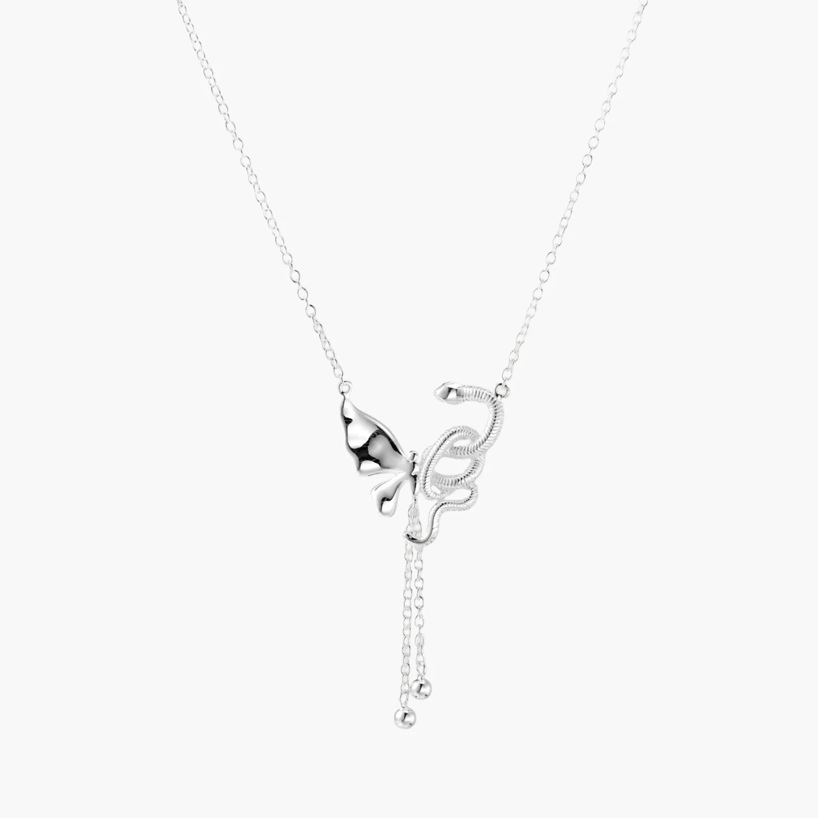 Silver necklace with a butterfly pendant on a white background